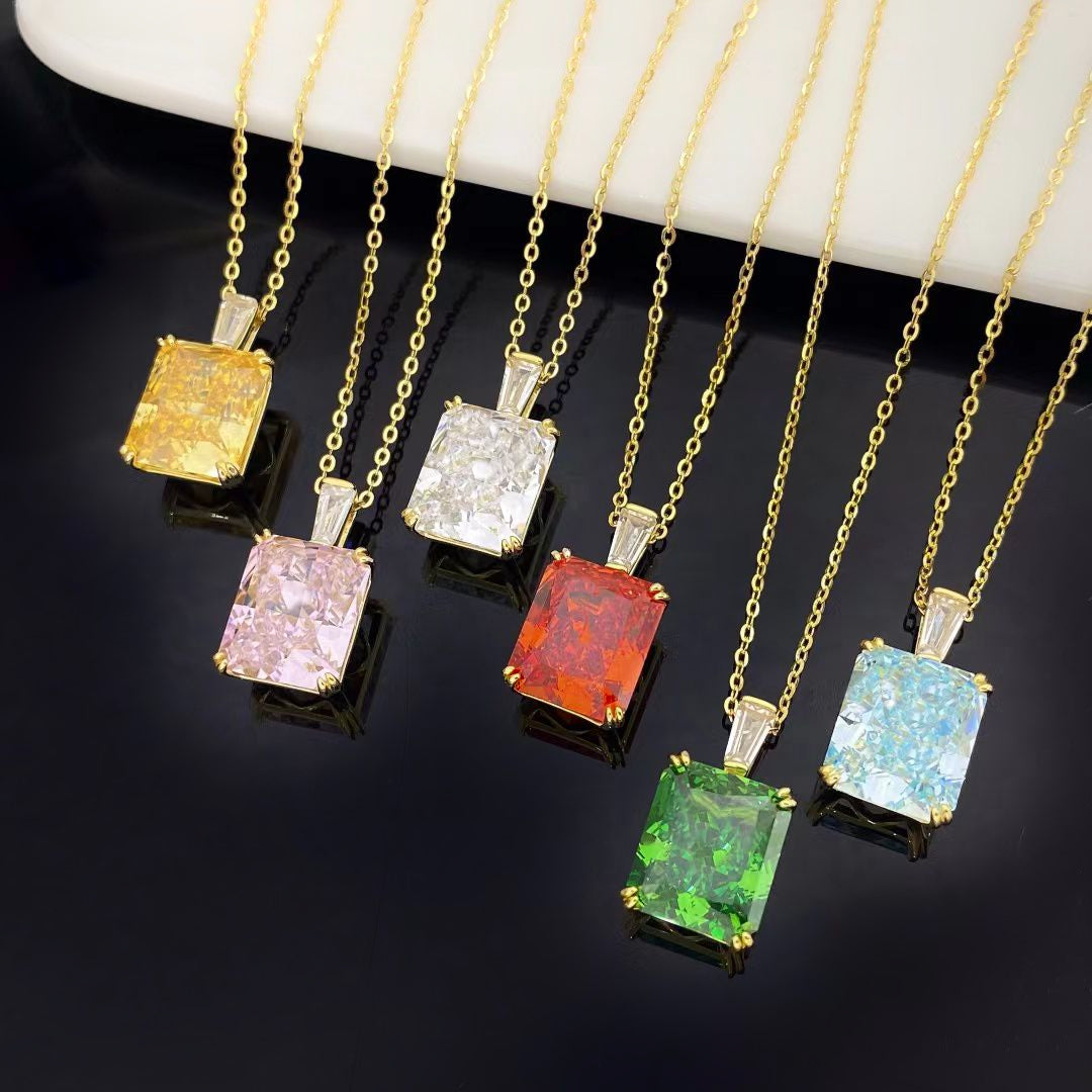 This exquisite sterling silver necklace features a vibrant Brazilian Madeira Citrine inspired orange nano gemstone, known for its exceptional brilliance and rich colour. The rectangular pendant is beautifully framed by luxurious gold plating, making it a standout piece for any jewellery collection.