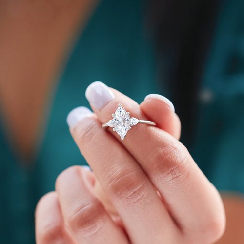 1.42ctw Marquise and Pear Shape Moissanite Three Stone Engagement Ring