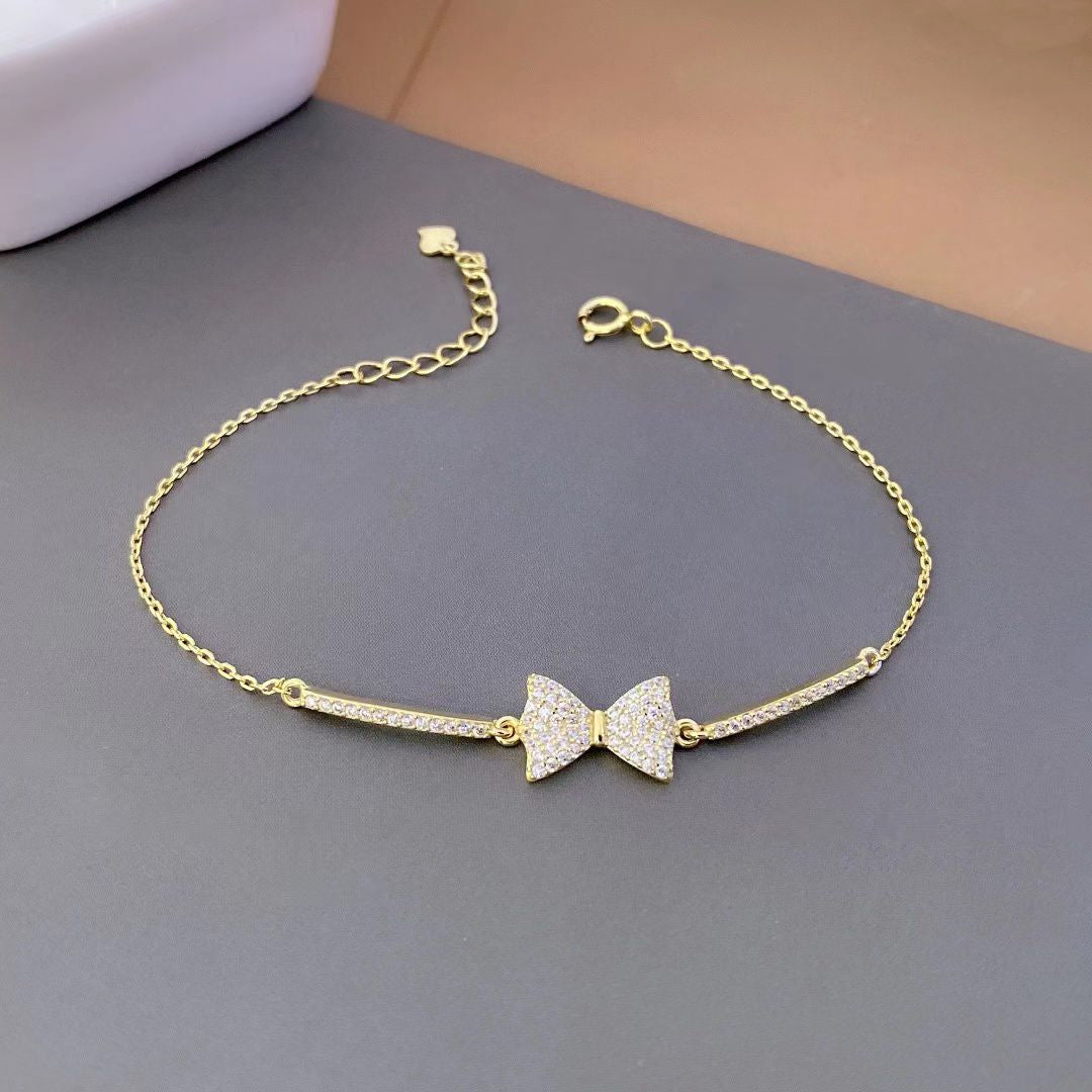 Embrace sophistication with our Elegant Bow-Tie Sterling Silver Bracelet, a true embodiment of grace and charm. 