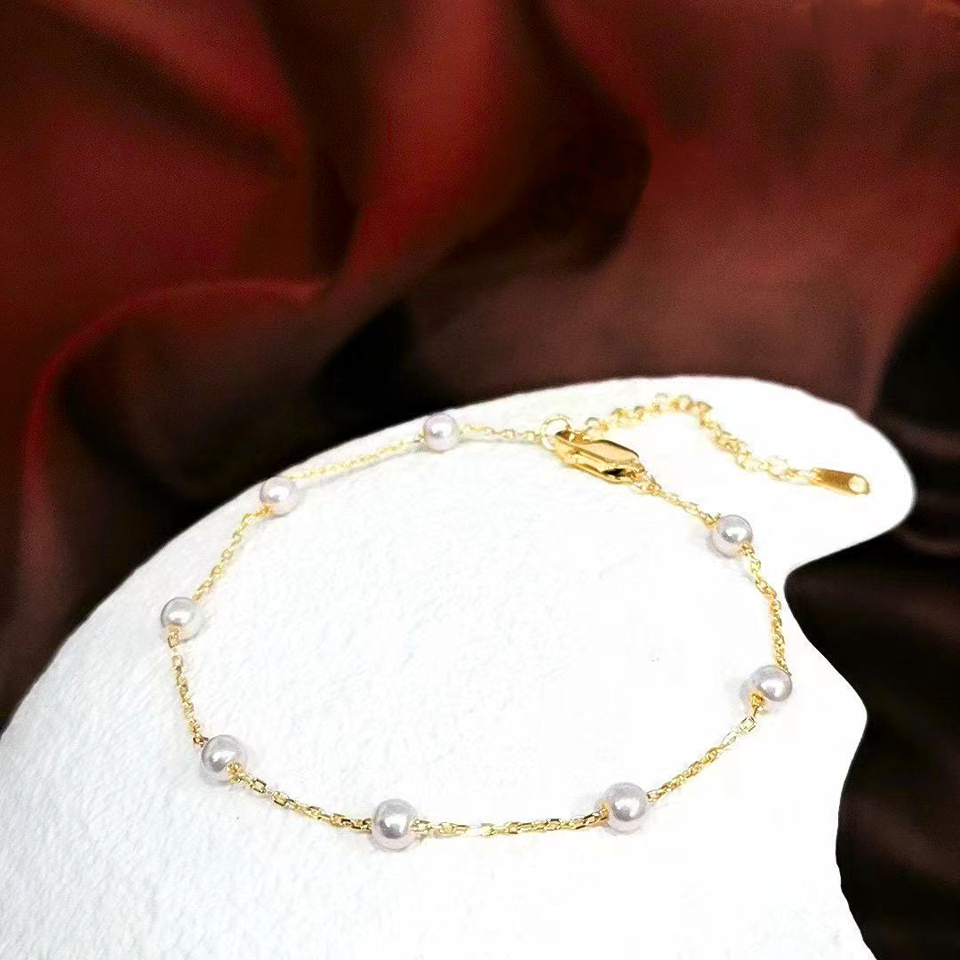 Embrace timeless elegance with our Classic Pearl Station Sterling Silver Bracelet. This delicate and refined piece is designed to add a touch of sophistication to any outfit