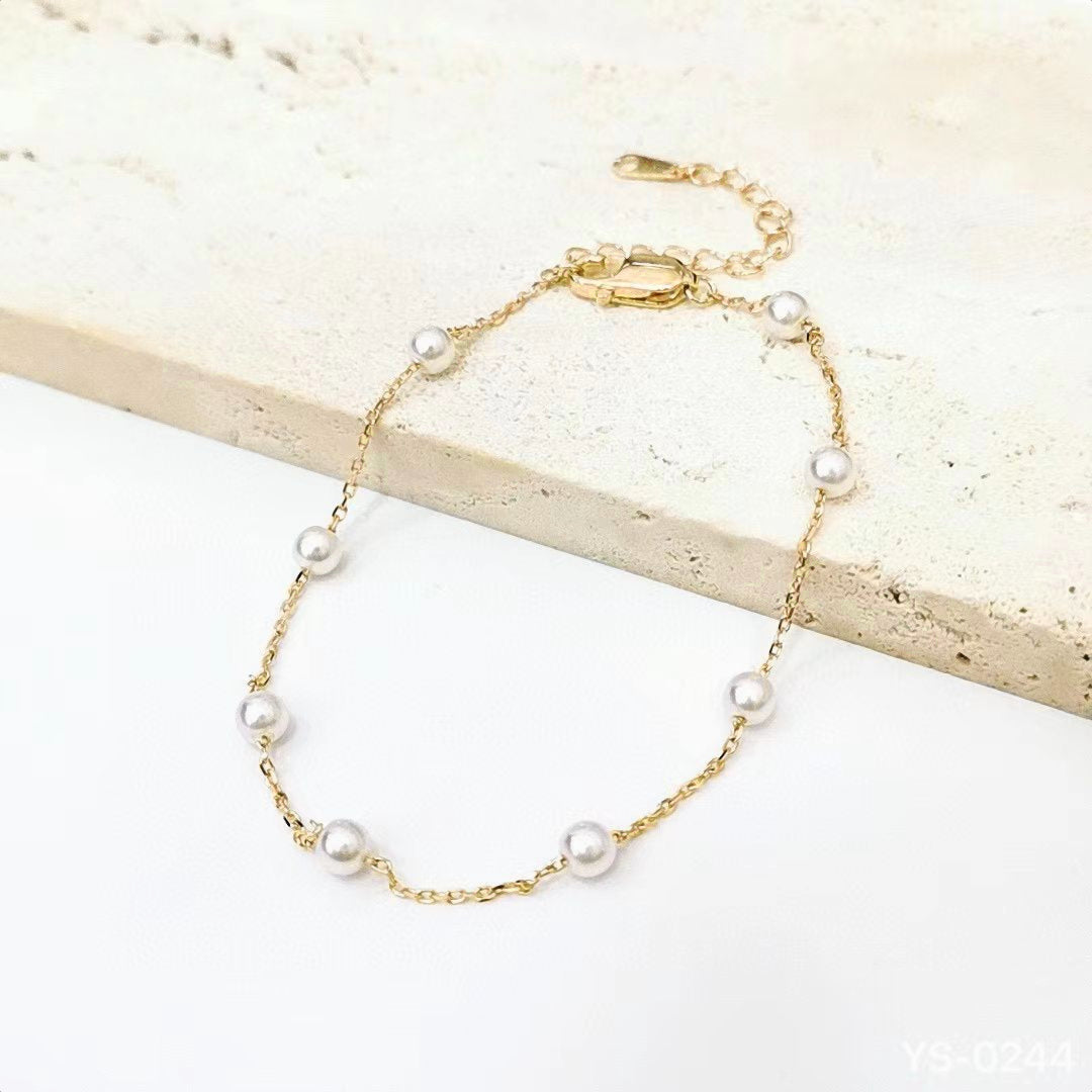 Embrace timeless elegance with our Classic Pearl Station Sterling Silver Bracelet. This delicate and refined piece is designed to add a touch of sophistication to any outfit