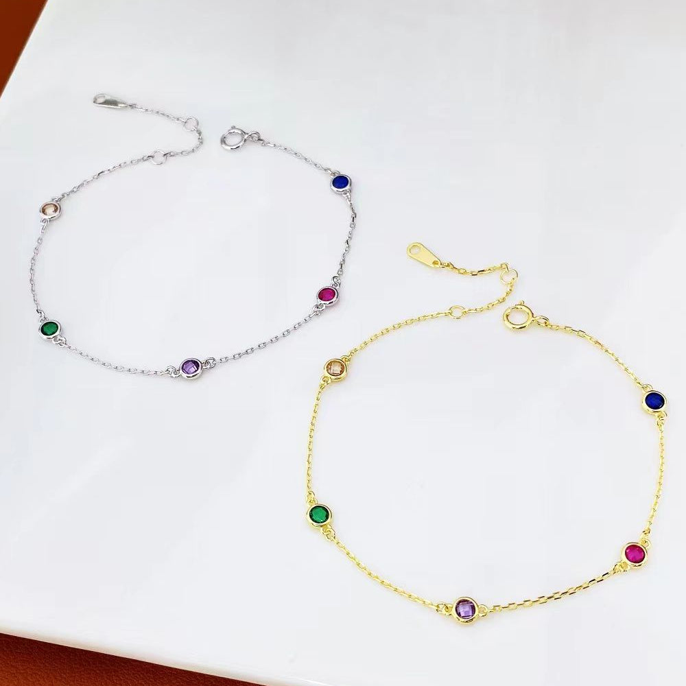 Add a splash of colour to your jewellery collection with this exquisite sterling silver bracelet, featuring a delicate chain adorned with vibrant multi-coloured gemstones. Each gemstone is carefully set to showcase its unique brilliance, creating a playful yet sophisticated look.