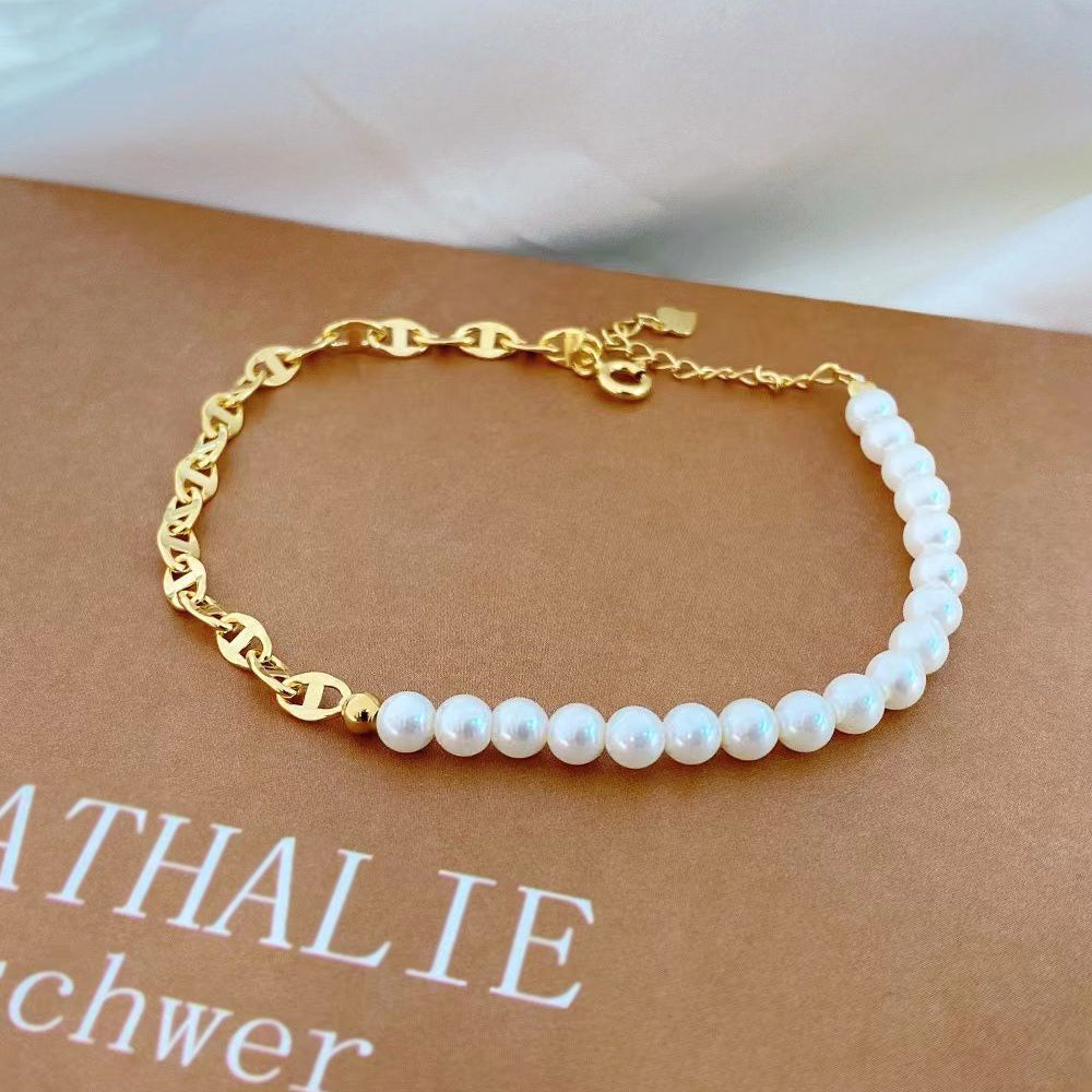 Elevate your style with this luxurious pearl and gold-plated sterling silver bracelet. Featuring a delicate chain of gold-plated sterling silver, this piece is beautifully accented with a strand of lustrous pearls. The combination of classic pearls and sophisticated gold plating creates a timeless and elegant look.