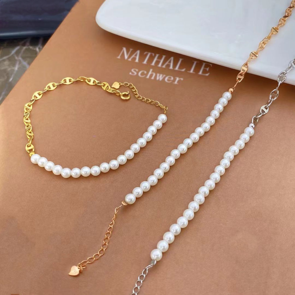 Elevate your style with this luxurious pearl and gold-plated sterling silver bracelet. Featuring a delicate chain of gold-plated sterling silver, this piece is beautifully accented with a strand of lustrous pearls. The combination of classic pearls and sophisticated gold plating creates a timeless and elegant look.