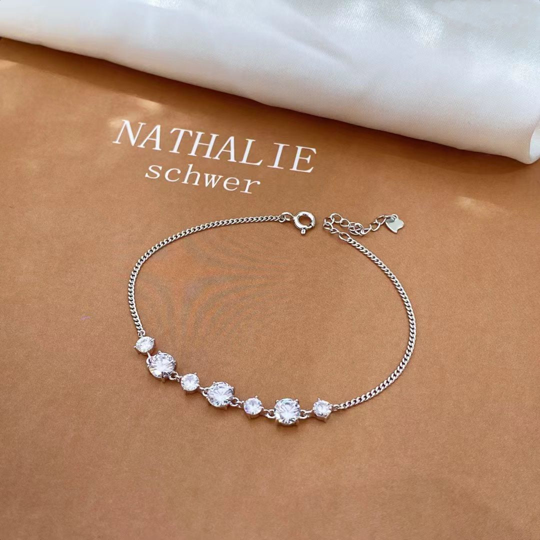 Elevate your style with our Celestial Sparkle CZ Sterling Silver Bracelet, a piece that effortlessly blends elegance with modern sophistication