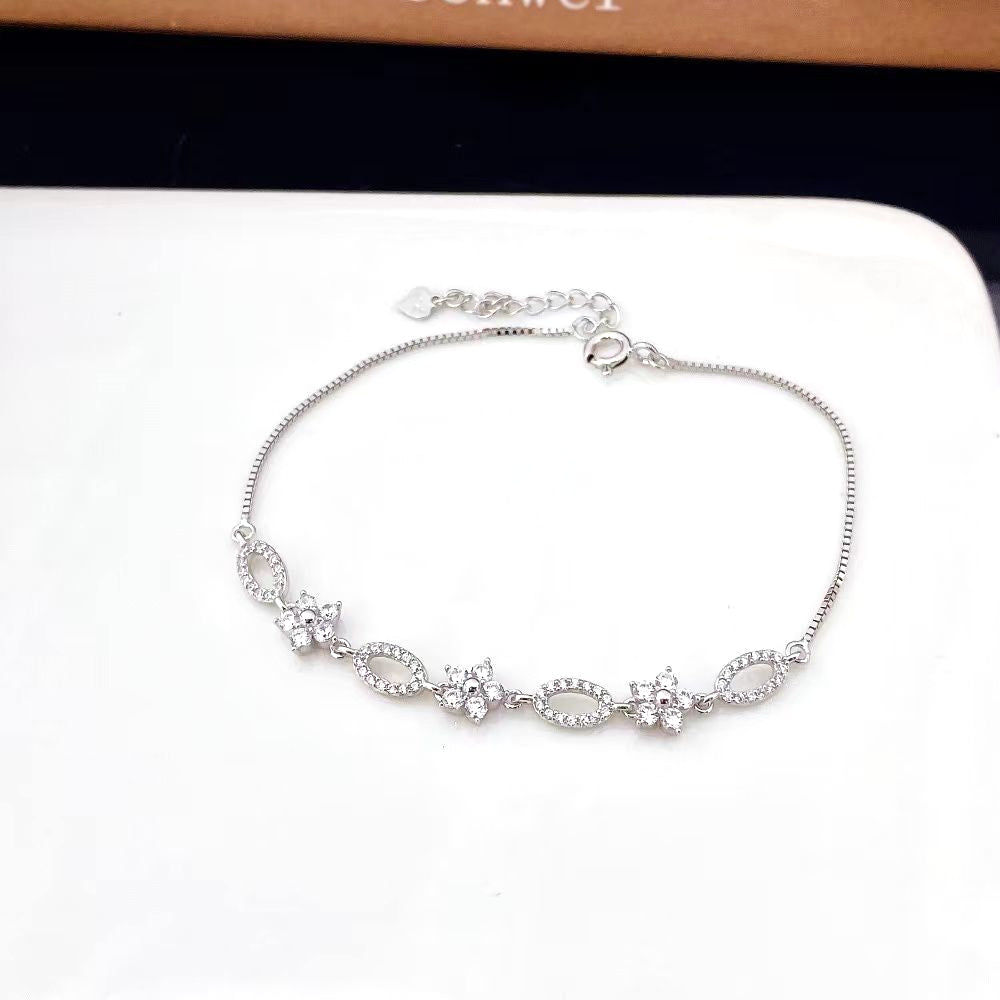 Oval and Floral Cubic Zirconia Sterling Silver Bracelet with Rhodium Plating