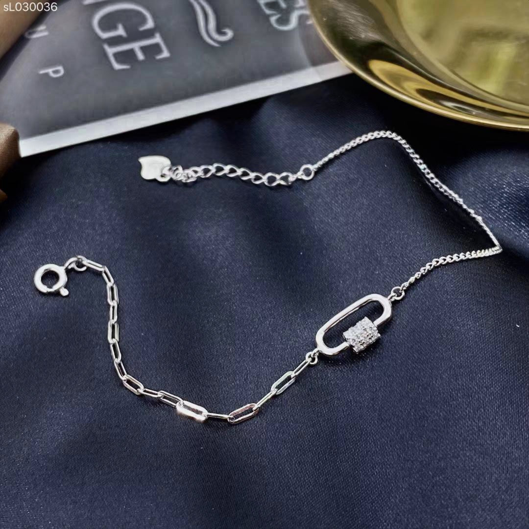 This exquisite sterling silver bracelet embodies timeless elegance and modern sophistication. Crafted from high-quality sterling silver, the bracelet features a sleek chain link and curb design that adds a touch of refinement to any outfit