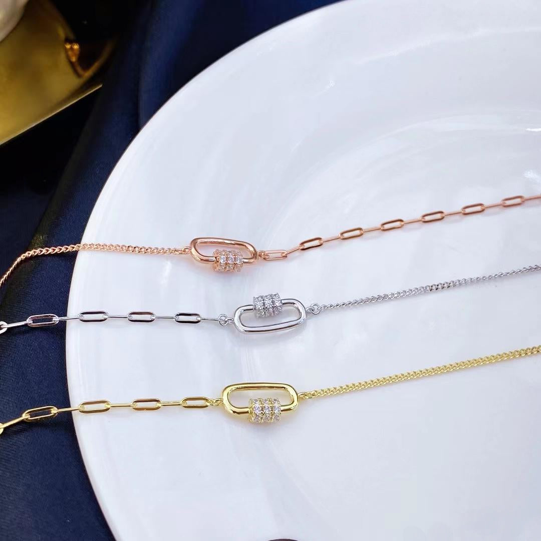 This unique sterling silver bracelet features a mix of delicate chain and modern link designs adorned with sparkling cubic zirconia stones. The rose gold plating adds a warm, sophisticated touch and helps prevent tarnishing, ensuring lasting beauty.