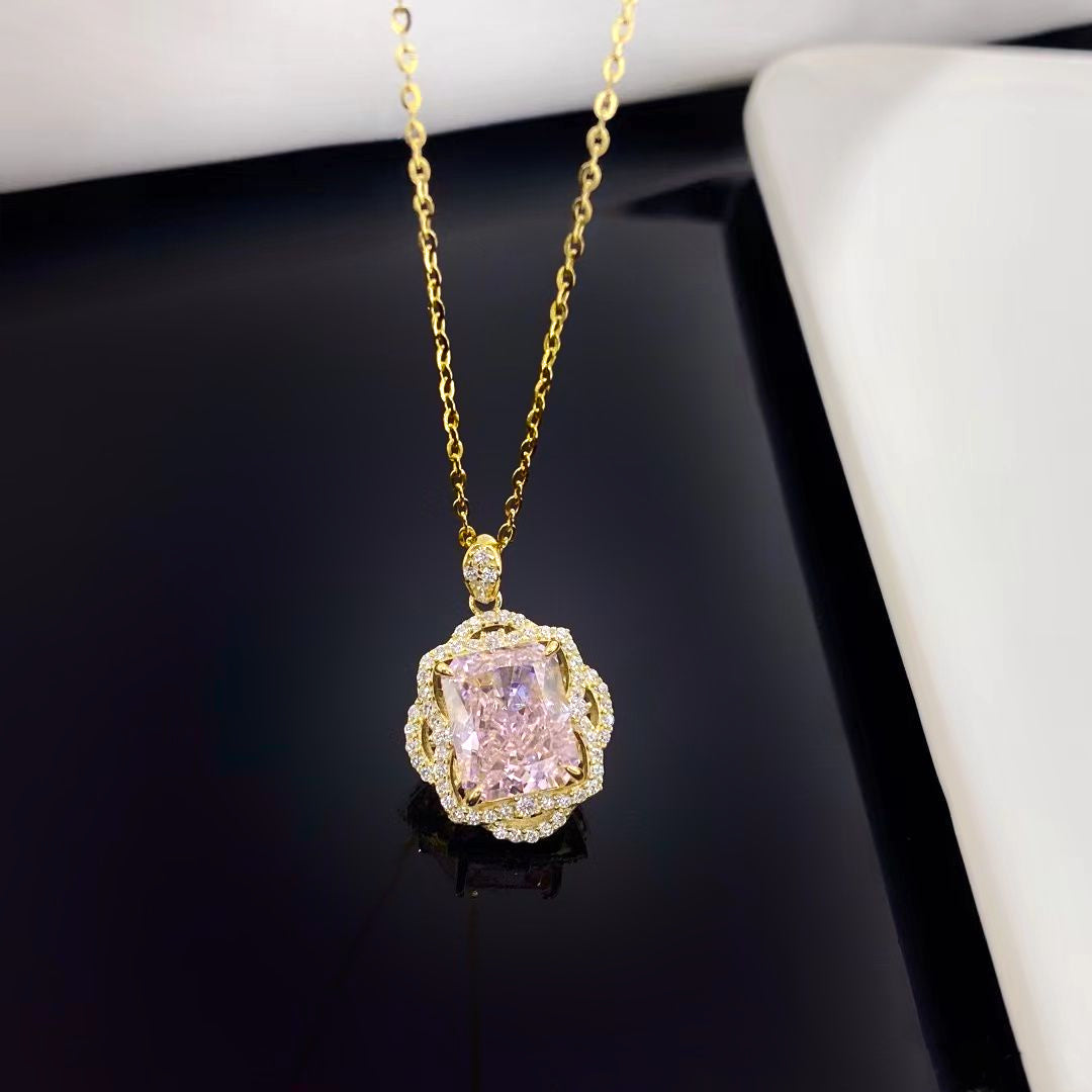 This exquisite sterling silver necklace features a radiant pink nano crystal, celebrated for its vibrant hue and dazzling sparkle. The pendant is elegantly surrounded by shimmering cubic zirconia and finished with a luxurious gold plating, making it a stunning addition to any jewellery collection.