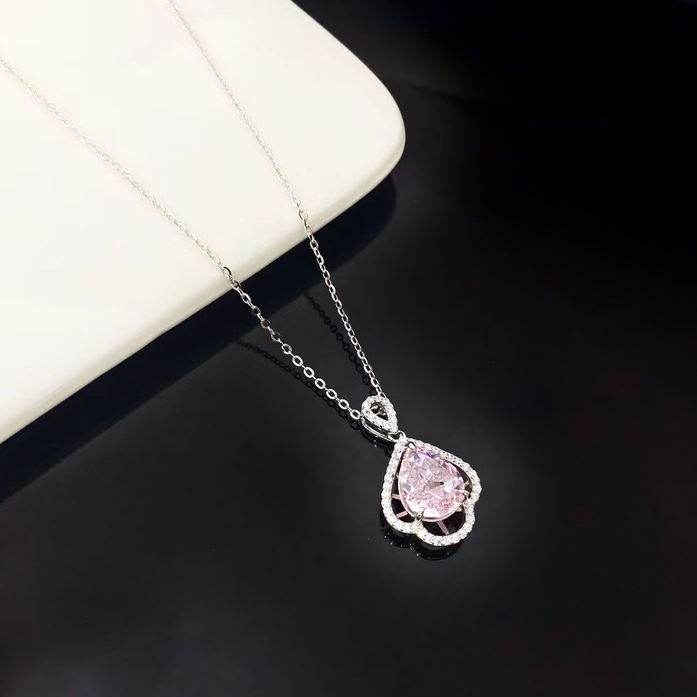 This elegant sterling silver necklace showcases a beautiful pink nano crystal, known for its exceptional sparkle and vibrant hue. The teardrop-shaped pendant is gracefully framed by shimmering cubic zirconia and finished with a sophisticated rhodium plating, making it a timeless addition to any jewellery collection.