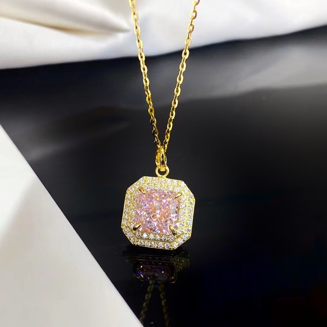 This beautiful sterling silver necklace features a captivating pink nano crystal, known for its exceptional sparkle and vibrant hue. The octagonal pendant is adorned with shimmering cubic zirconia and finished with luxurious gold plating, creating a piece that exudes elegance and charm.