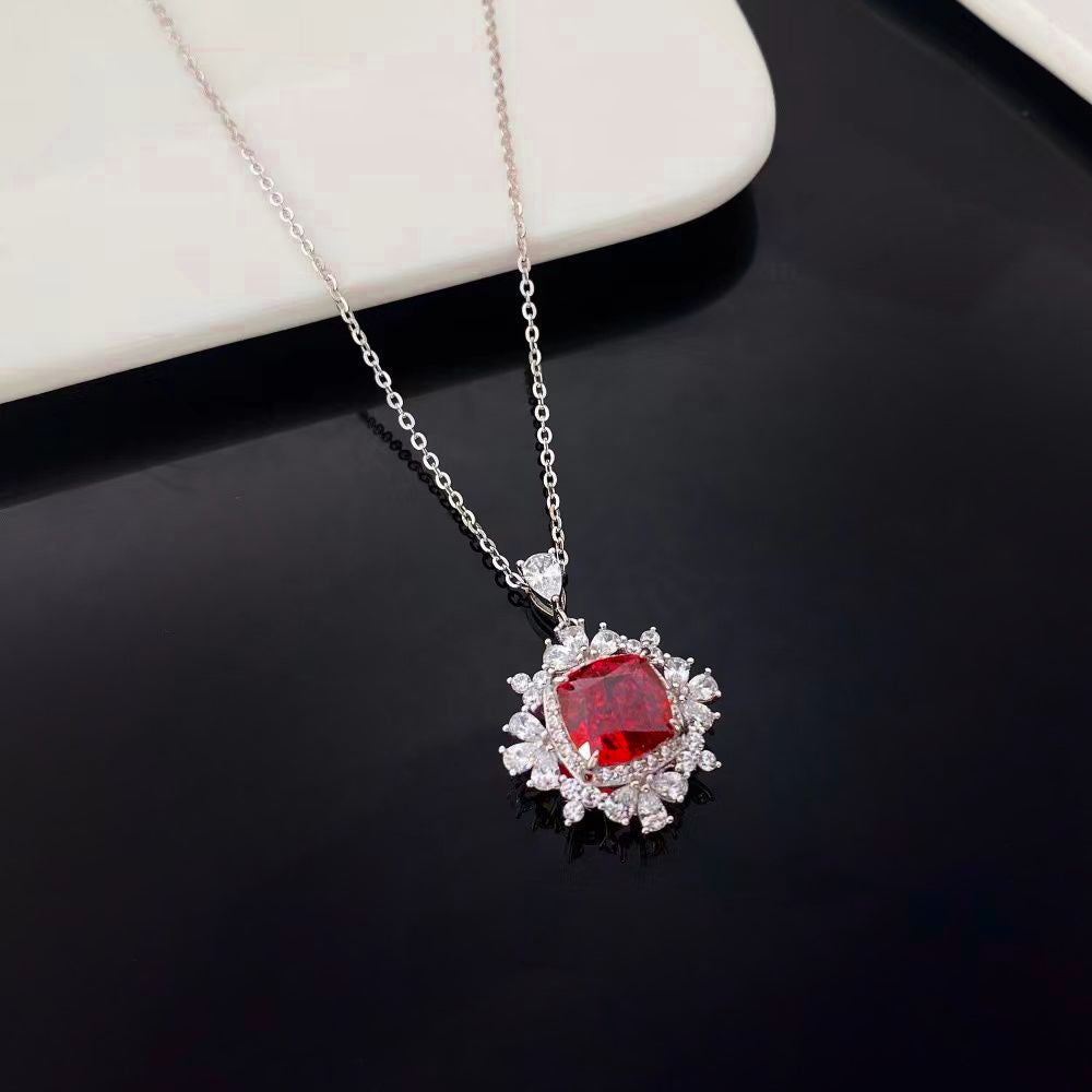 This stunning sterling silver necklace features a vibrant red nano crystal, celebrated for its exceptional brilliance and color consistency. The pendant is encased in a rhodium-plated frame adorned with sparkling cubic zirconia, adding a touch of luxury and sophistication. This piece is perfect for any jewellery collection, offering timeless elegance and modern style.