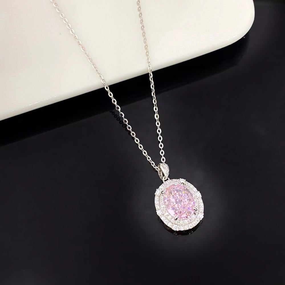 This beautiful sterling silver necklace features a captivating pink nano crystal, known for its exceptional brilliance and vibrant hue. The oval pendant is encircled by sparkling cubic zirconia and finished with a sophisticated rhodium plating, making it a standout piece for any jewellery collection.