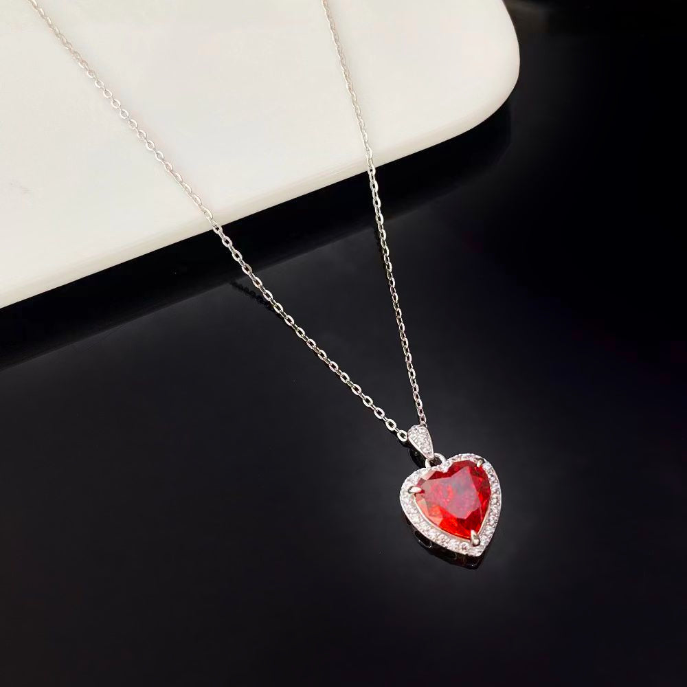 This beautiful sterling silver necklace showcases a heart-shaped red nano crystal, known for its dazzling brilliance and vibrant colour. The pendant is framed with sparkling cubic zirconia and rhodium plating, enhancing its elegance and sophistication. Perfect for adding a touch of luxury to any jewellery collection.