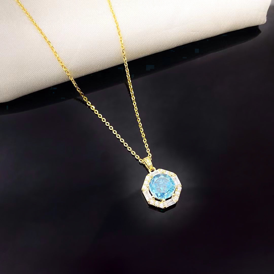 This sterling silver necklace features a mesmerising sky blue nano crystal, known for its exceptional brilliance and vibrant colour. The octagonal pendant is framed by sparkling cubic zirconia and finished with luxurious gold plating, creating a piece that exudes elegance and sophistication.